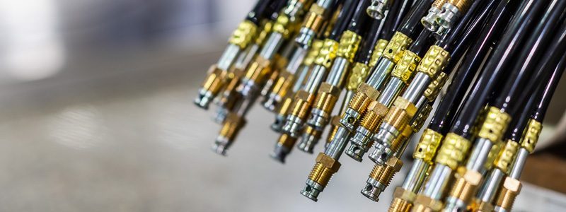 Pile of welding cables with ends neatly aligned, demonstrating precision and quality.